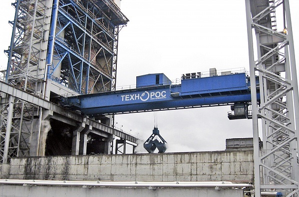 Special bridge crane with a grab